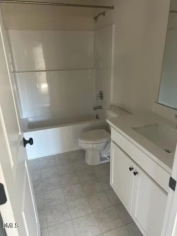 a bathroom with a bathtub and a toilet