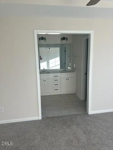 a view of a bathroom with mirror