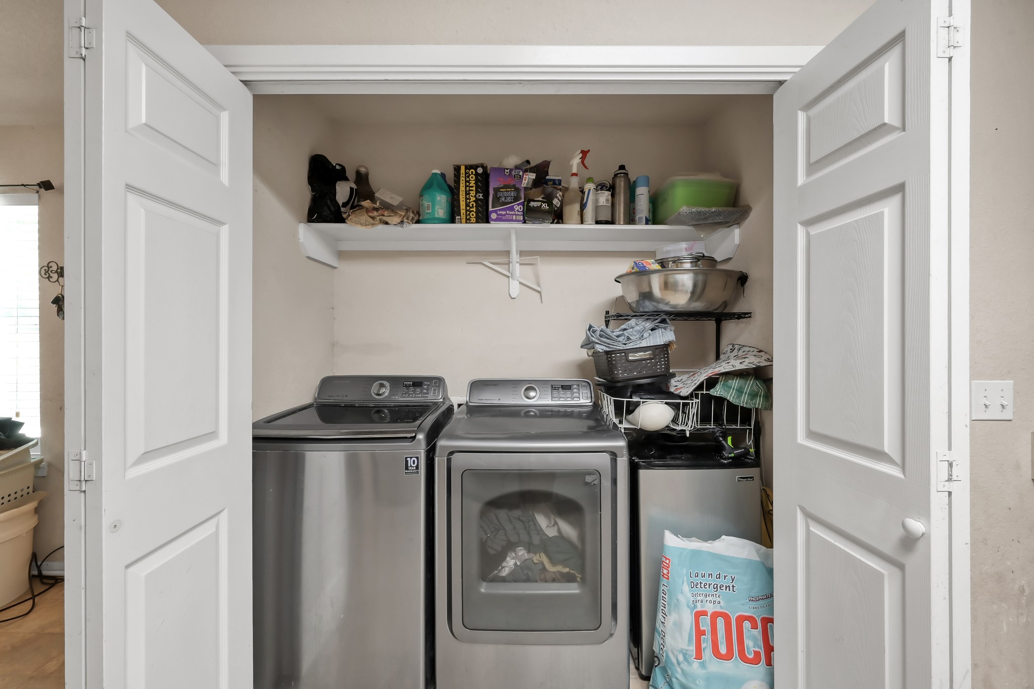 805 Webb Street Conroe, TX 77301 - Photo 12 of 19 a kitchen with a stove and a refrigerator