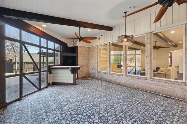 a view of front door with furniture and a window