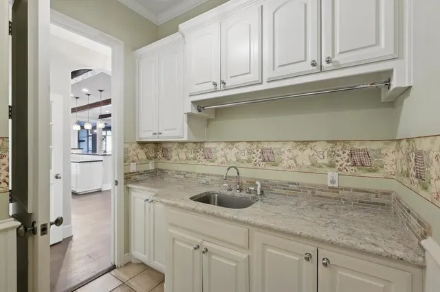 a kitchen with a sink and cabinets