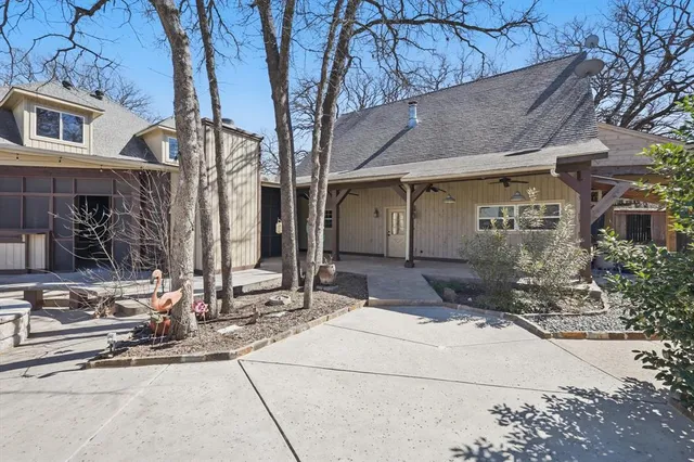a front view of a building with small garden