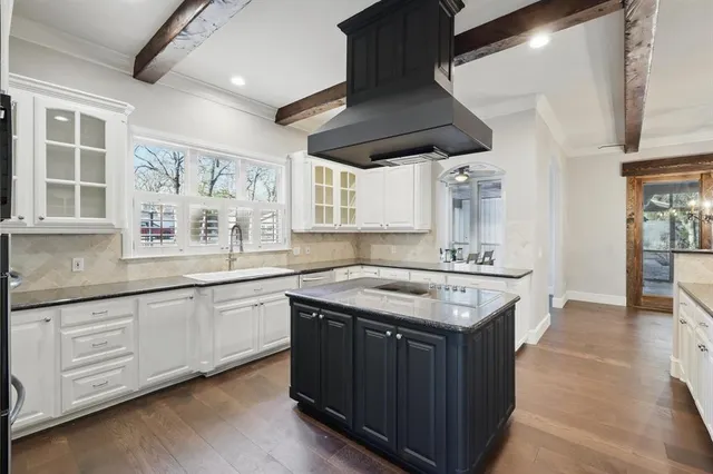 a kitchen with stainless steel appliances granite countertop a stove and a sink