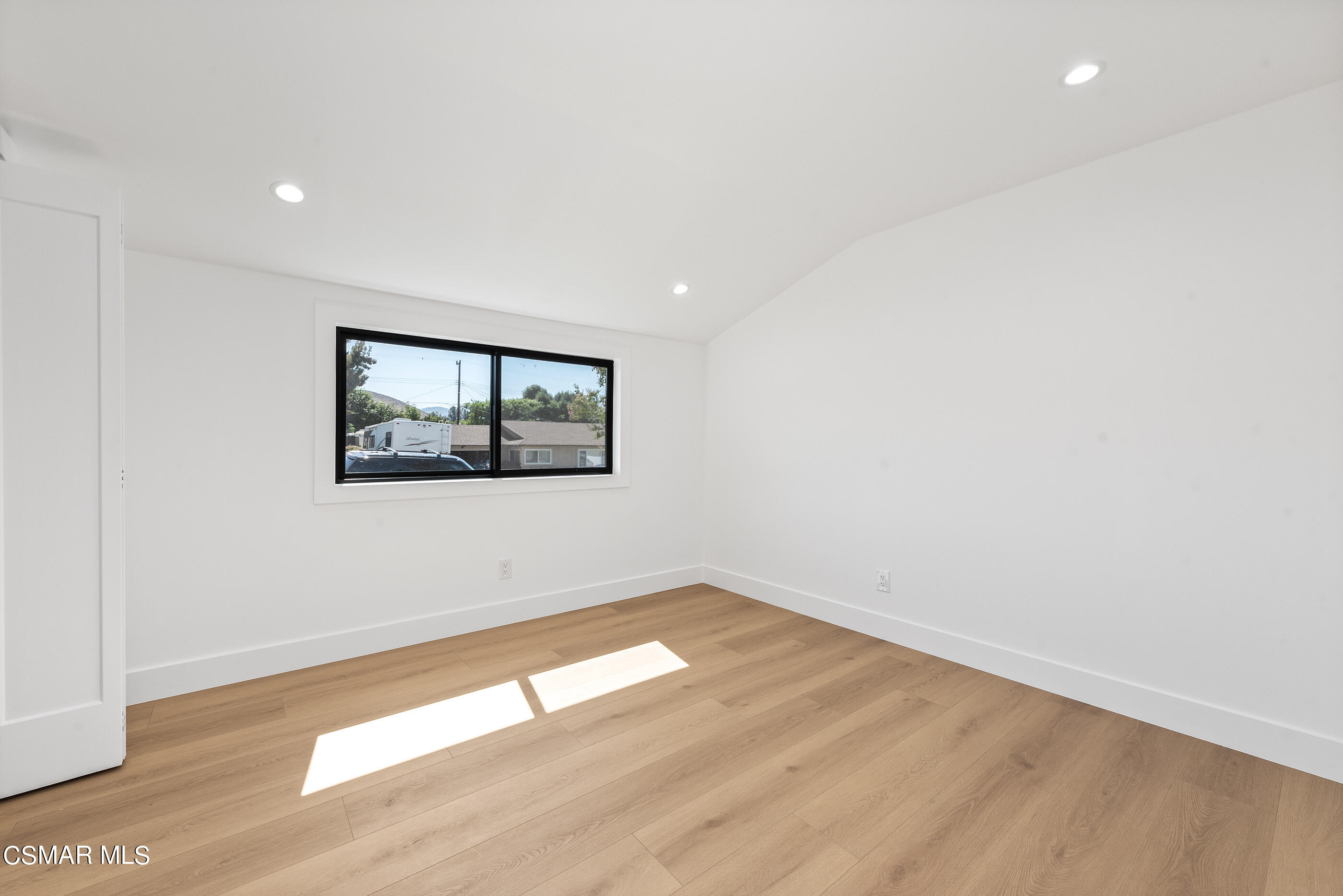3343 Austin Avenue Simi Valley, CA 93063 - Photo 22 of 40 an empty room with wooden floor and windows