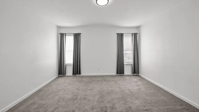 a view of an empty room and window