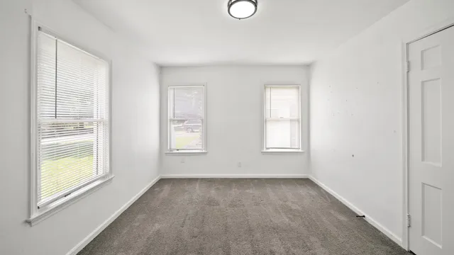 an empty room with windows