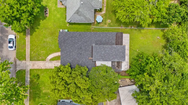 an aerial view of a house with a garden