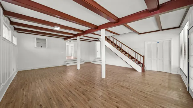 a view of an entryway with wooden floor