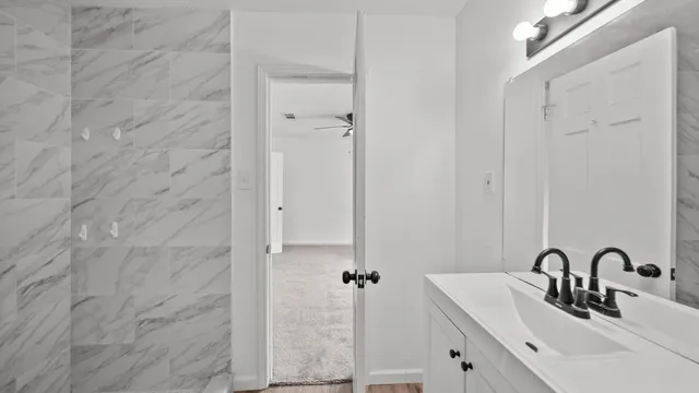 a bathroom with a sink and a mirror
