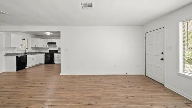 a view of kitchen with wooden floor