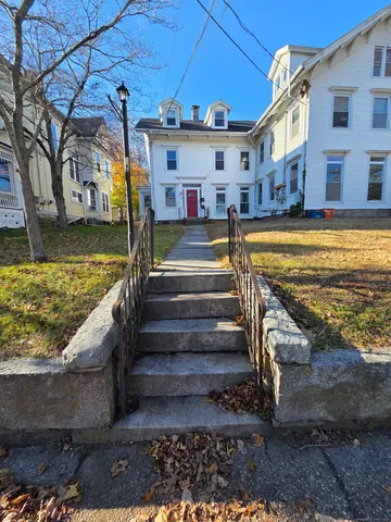 a view of residential houses with outdoor space