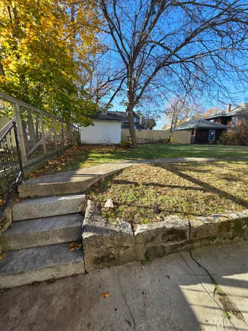 a view of a yard with an outdoor space