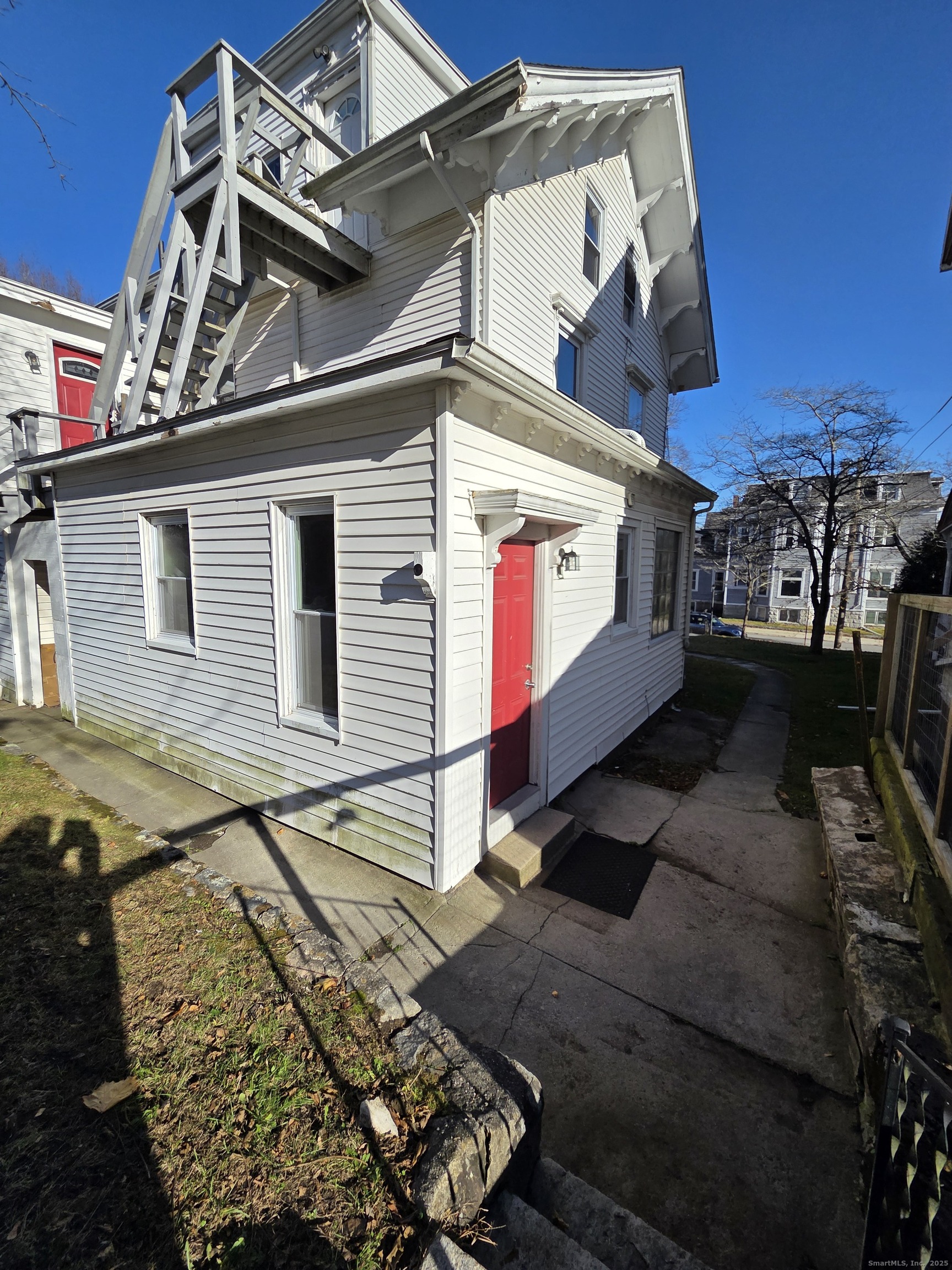 32 Channing Street, Unit 1 New London, CT 06320 - Photo 3 of 13 a view of a street with houses