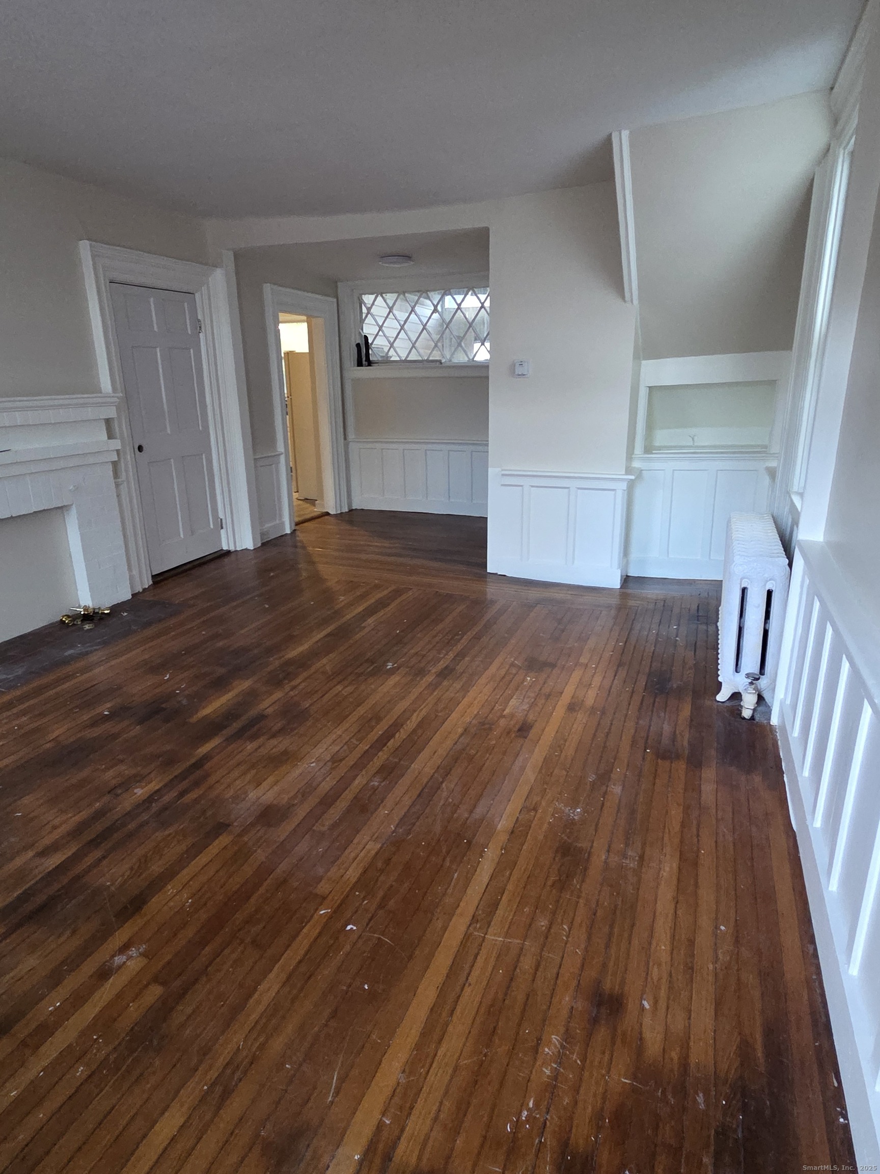 32 Channing Street, Unit 1 New London, CT 06320 - Photo 5 of 13 wooden floor in an empty room with wooden floor