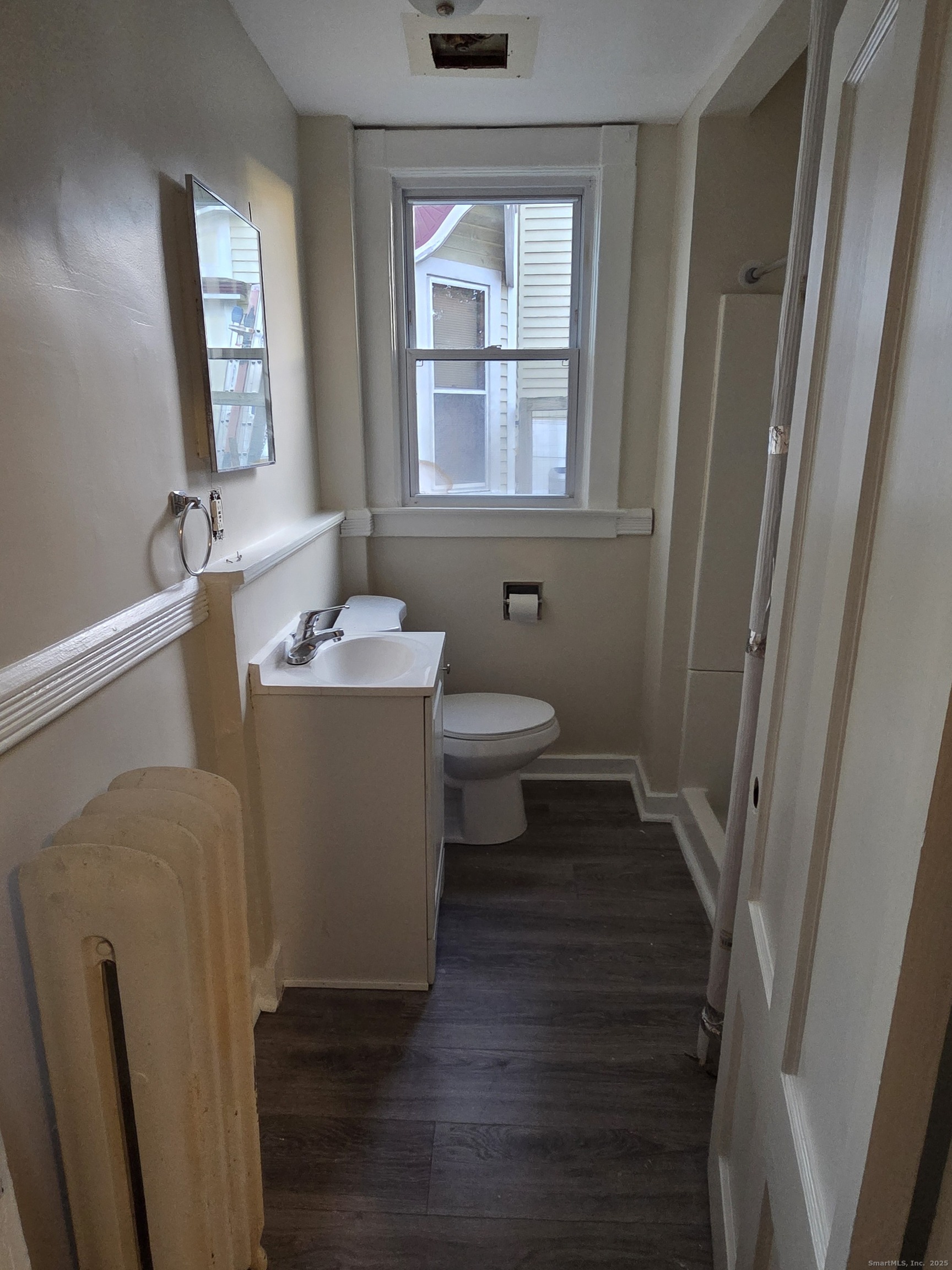 32 Channing Street, Unit 1 New London, CT 06320 - Photo 9 of 13 a bathroom with a sink toilet and vanity