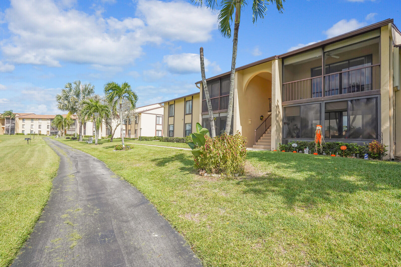 826 Sky Pine Way, Unit G2 Greenacres, FL 33415 - Photo 1 of 30 a view of a house with a yard