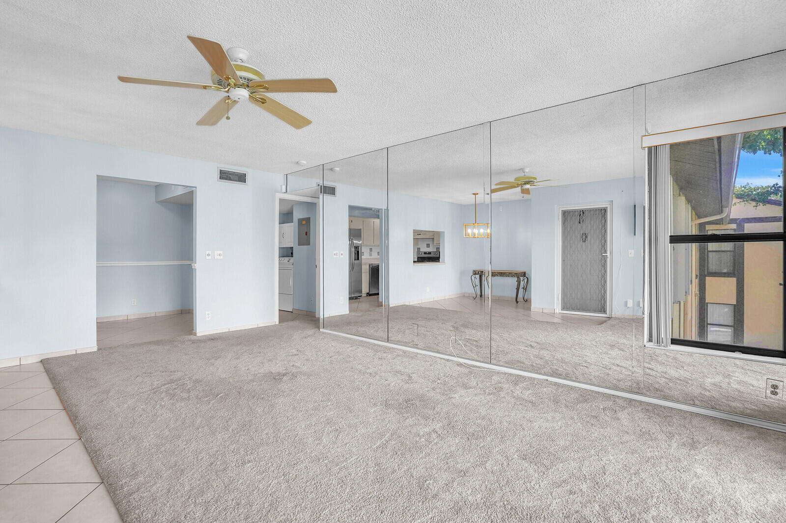826 Sky Pine Way, Unit G2 Greenacres, FL 33415 - Photo 11 of 30 a view of a livingroom with a furniture and a ceiling fan