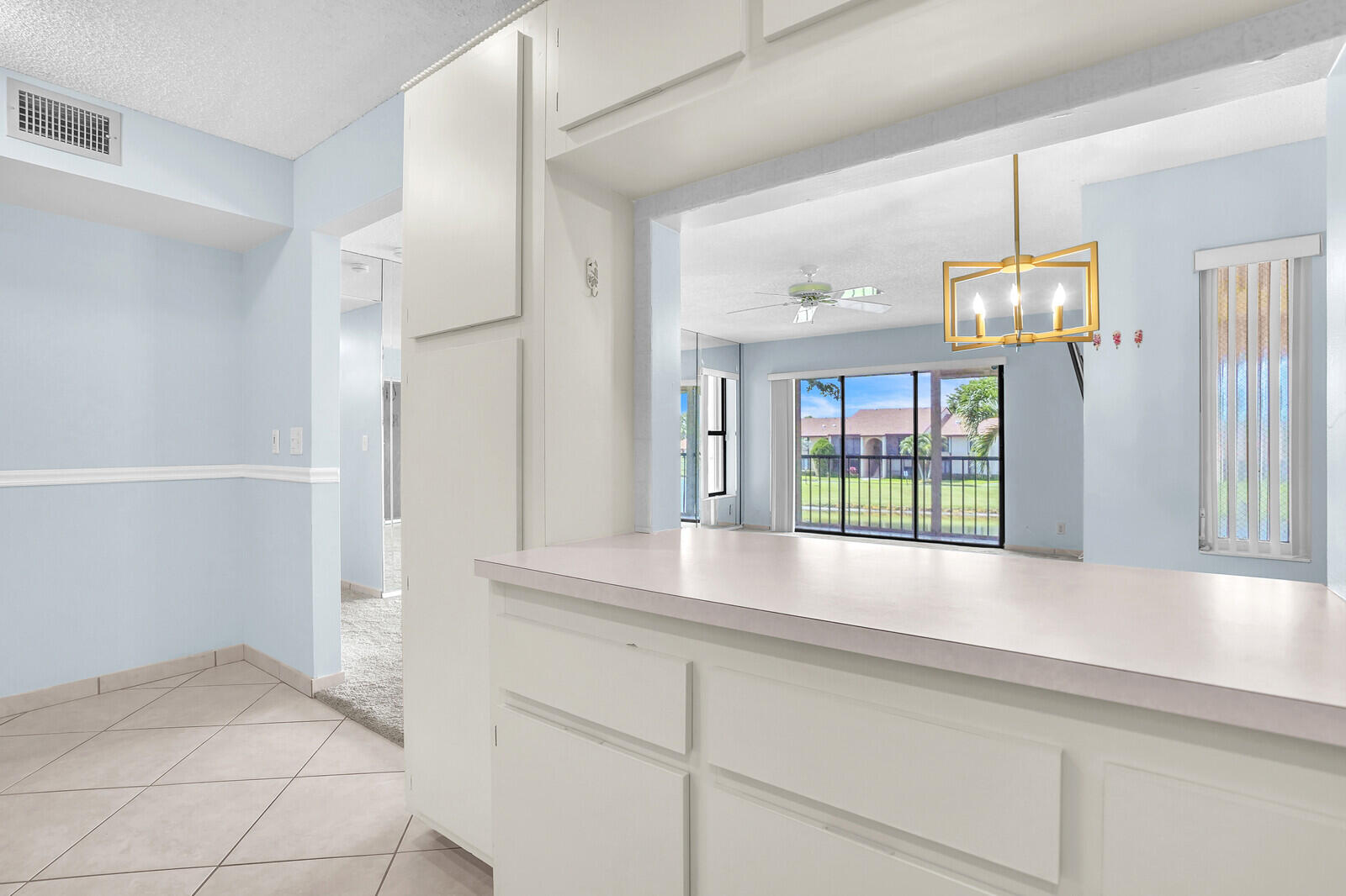 826 Sky Pine Way, Unit G2 Greenacres, FL 33415 - Photo 17 of 30 a view of an entryway with chandelier