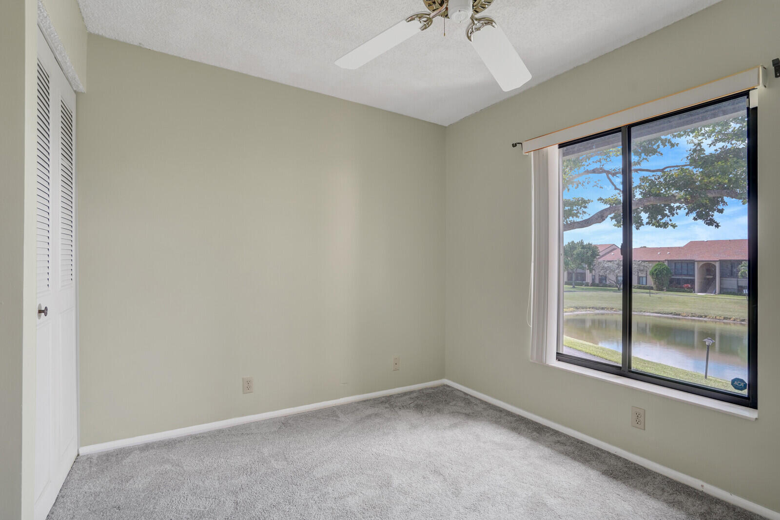 826 Sky Pine Way, Unit G2 Greenacres, FL 33415 - Photo 20 of 30 an empty room with a window
