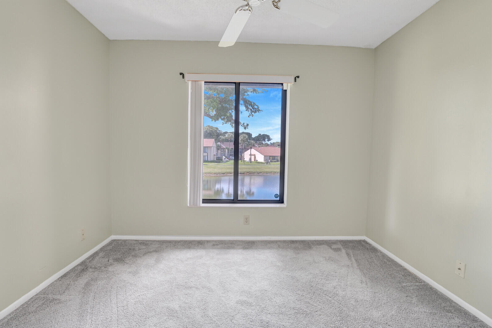 826 Sky Pine Way, Unit G2 Greenacres, FL 33415 - Photo 21 of 30 an empty room with a window