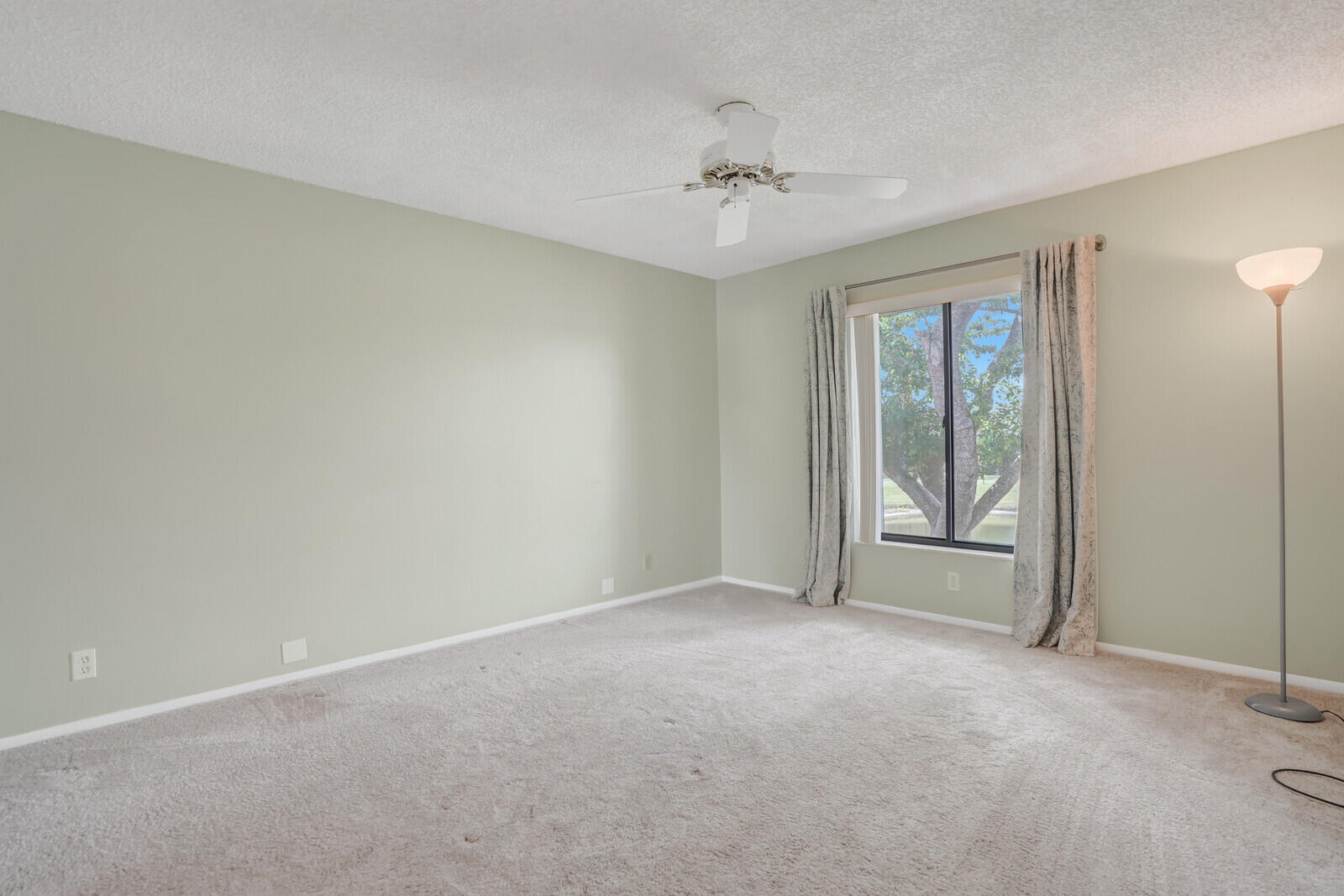 826 Sky Pine Way, Unit G2 Greenacres, FL 33415 - Photo 23 of 30 a view of an empty room with a fan
