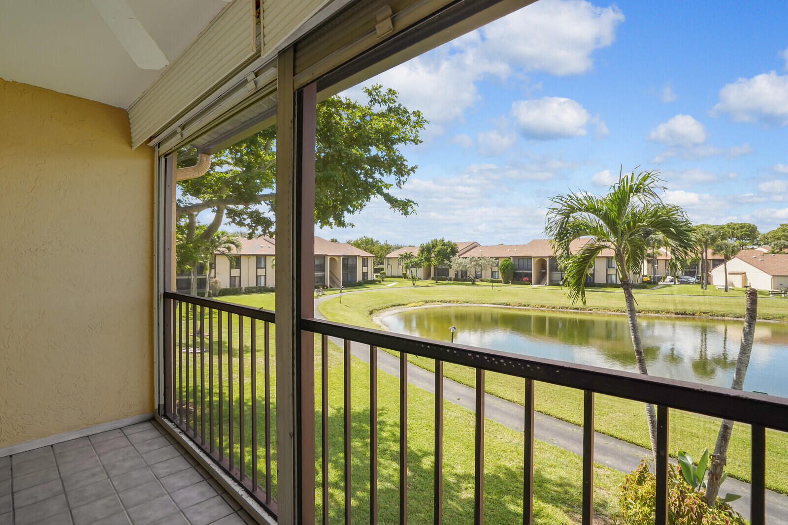 826 Sky Pine Way, Unit G2 Greenacres, FL 33415 - Photo 30 of 30 a view of swimming pool from a balcony