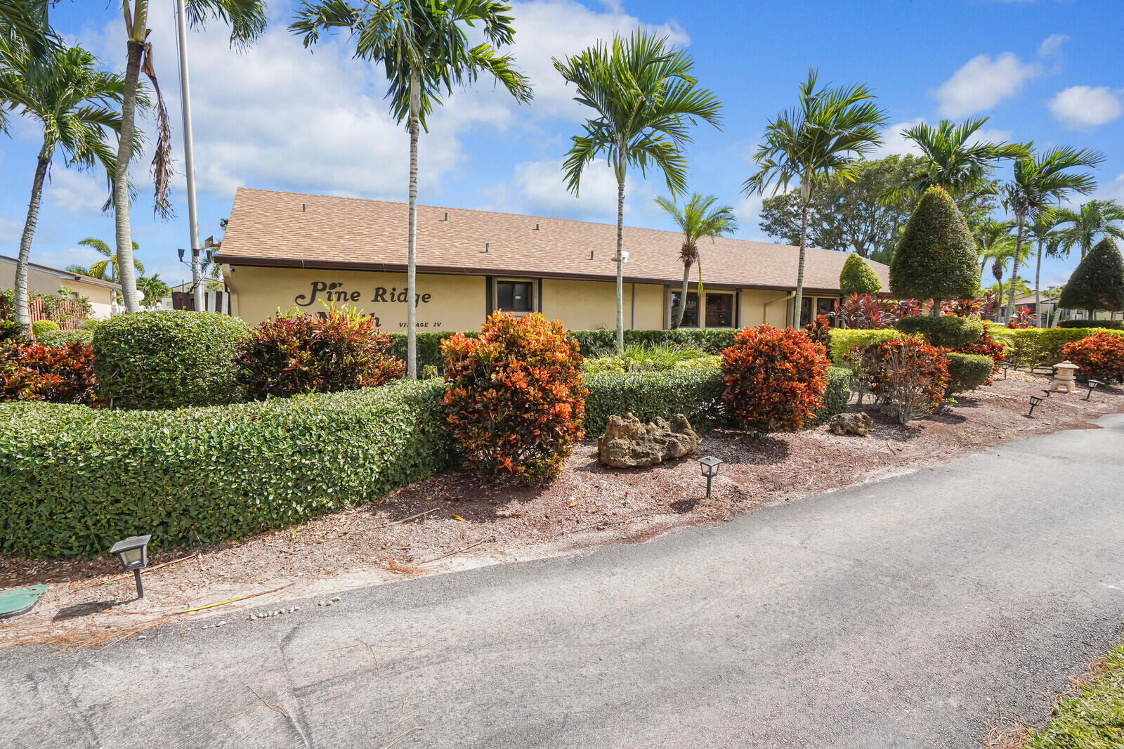 826 Sky Pine Way, Unit G2 Greenacres, FL 33415 - Photo 7 of 30 a front view of a house with a garden