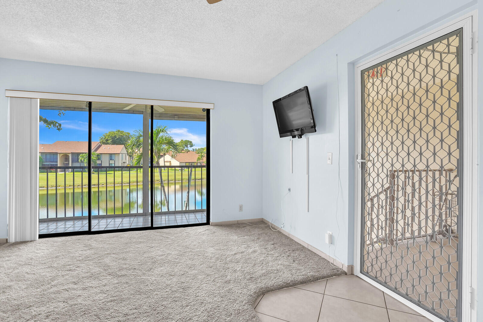 826 Sky Pine Way, Unit G2 Greenacres, FL 33415 - Photo 8 of 30 an empty room with sliding door
