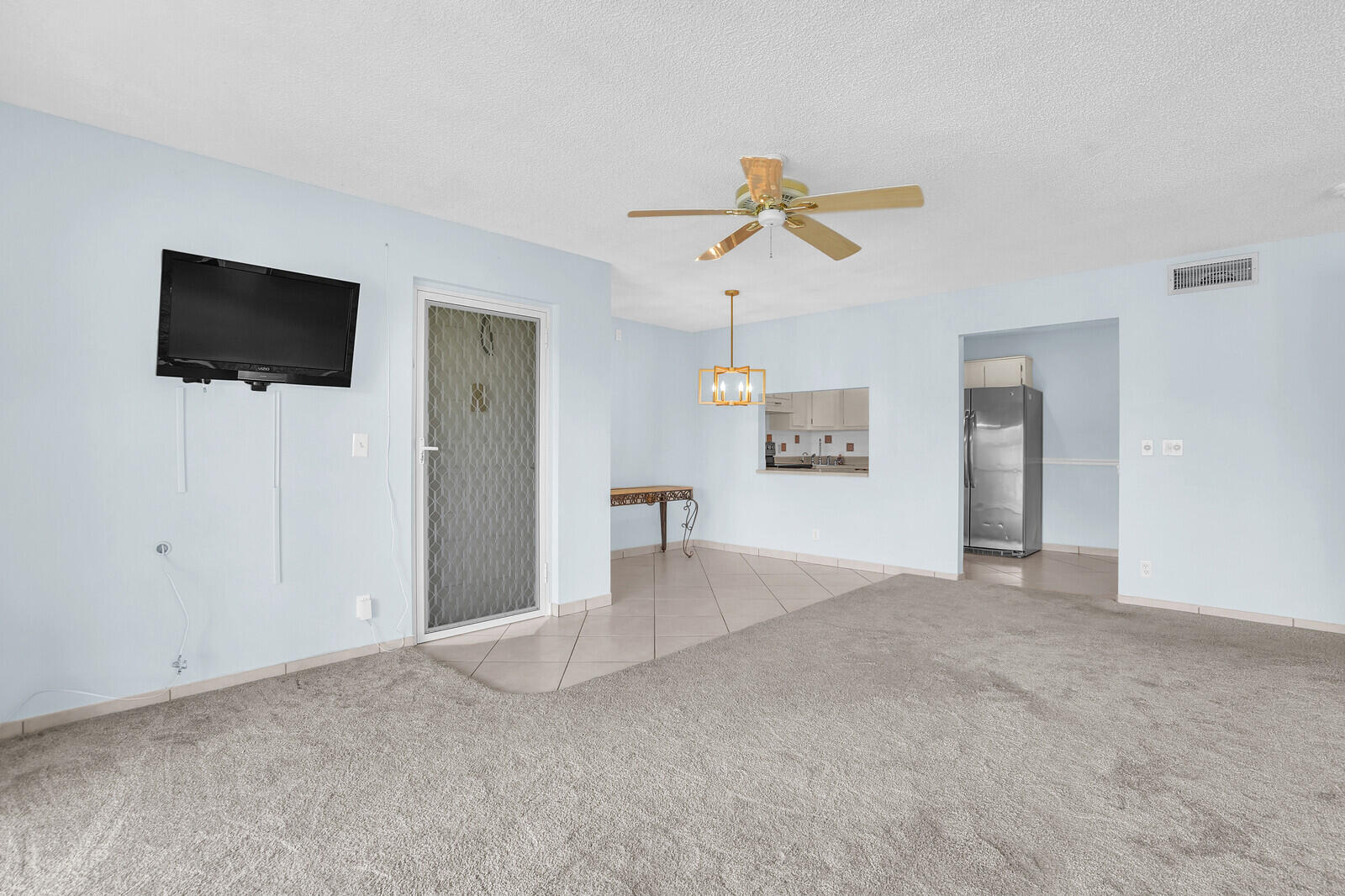 826 Sky Pine Way, Unit G2 Greenacres, FL 33415 - Photo 10 of 30 a view of a livingroom with a flat screen tv