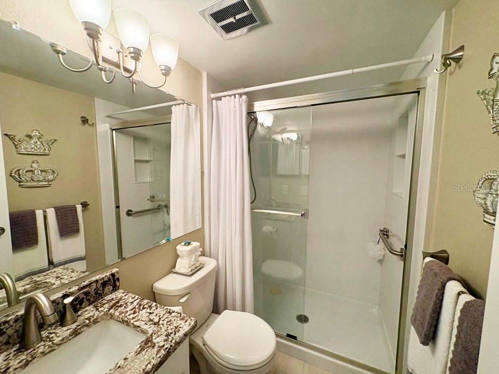 4455 Duhme Road, Unit 103 St. Petersburg, FL 33708 - Photo 25 of 37 a bathroom with a sink toilet and shower