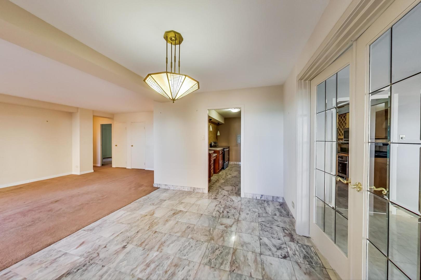 1350 North Astor Street, Unit 9B Chicago, IL 60610 - Photo 11 of 25 a view of empty room with wooden floor