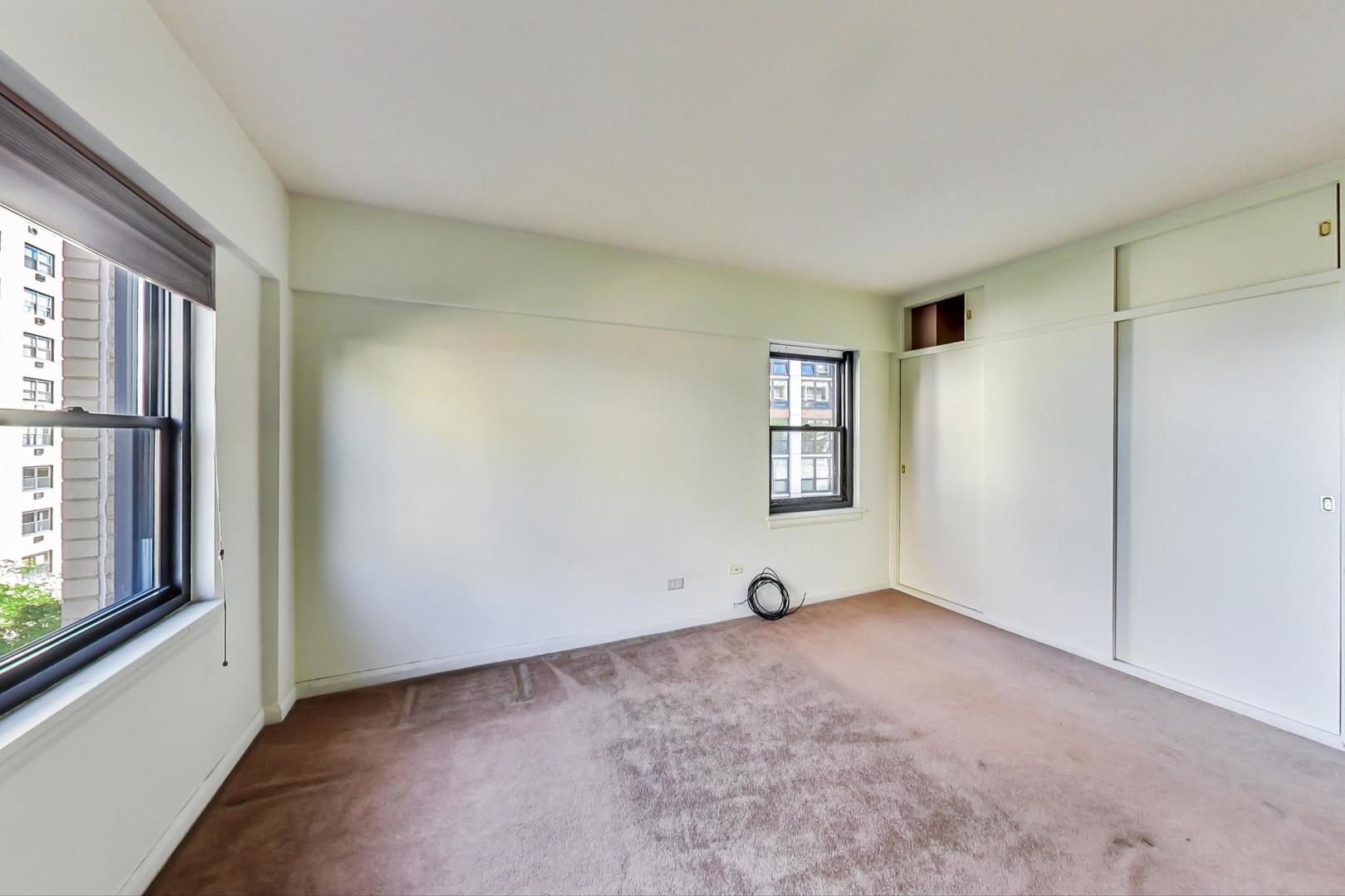 1350 North Astor Street, Unit 9B Chicago, IL 60610 - Photo 15 of 25 a view of an empty room with a window