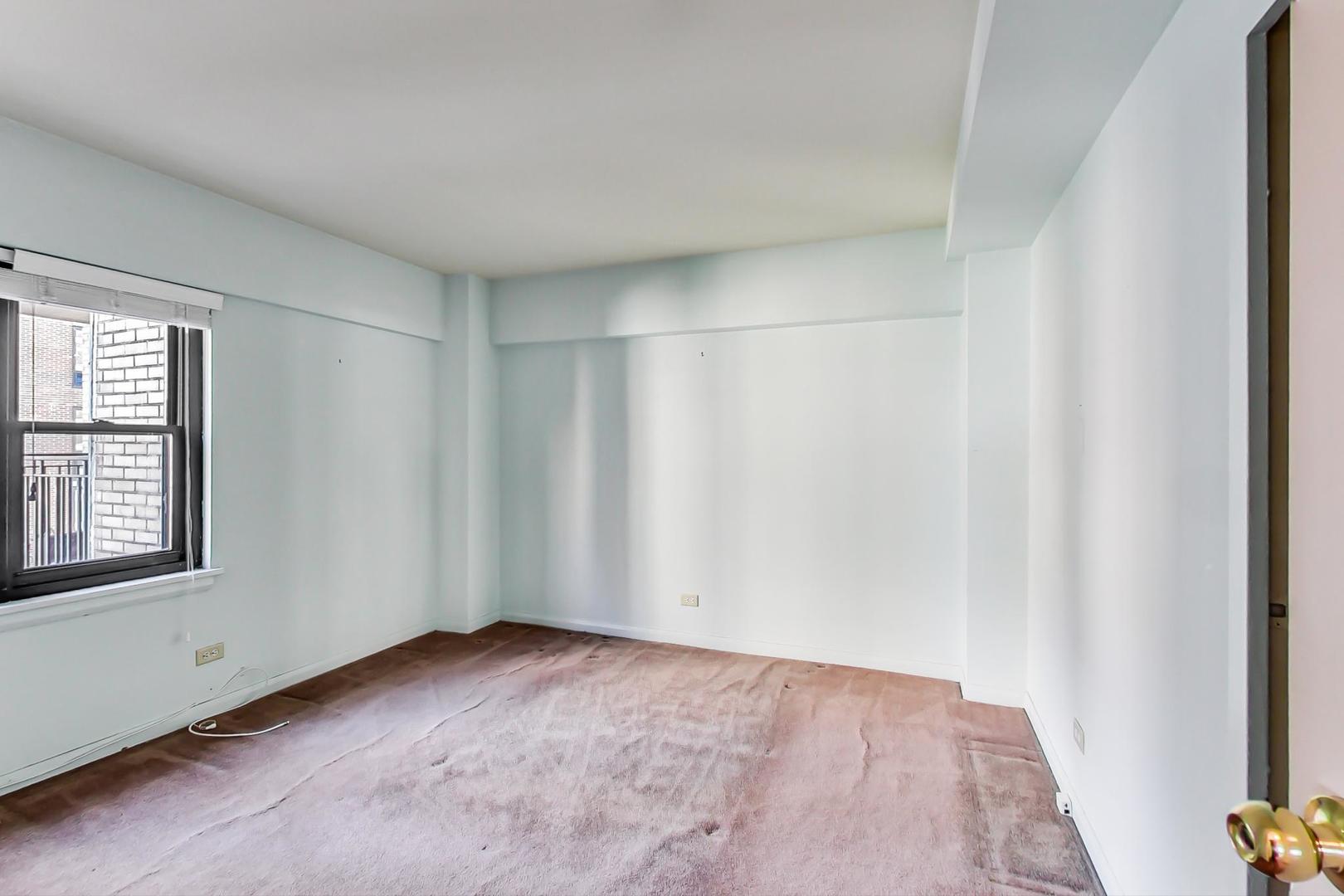 1350 North Astor Street, Unit 9B Chicago, IL 60610 - Photo 16 of 25 an empty room with windows