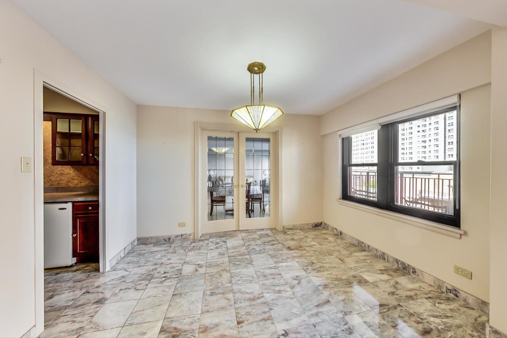 1350 North Astor Street, Unit 9B Chicago, IL 60610 - Photo 9 of 25 a view of an empty room with a window