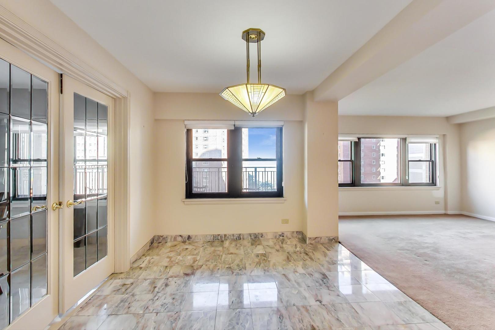 1350 North Astor Street, Unit 9B Chicago, IL 60610 - Photo 10 of 25 a view of an entryway with wooden floor and a front door
