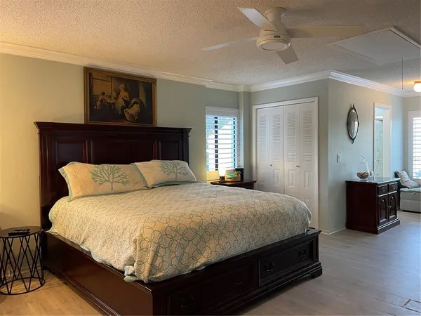 a bedroom with a bed and a table