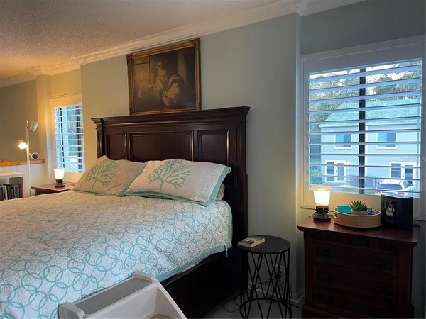 a room with a bed and a mirror