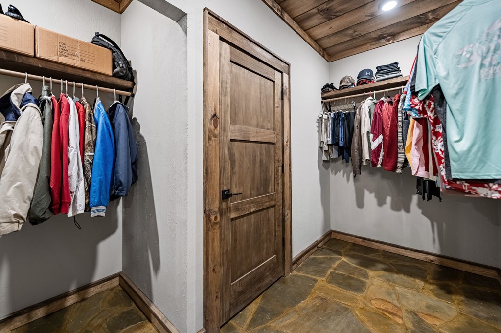 184 Spence Road Epworth, GA 30541 - Photo 21 of 62 a view of walk in closet with clothes and shoes