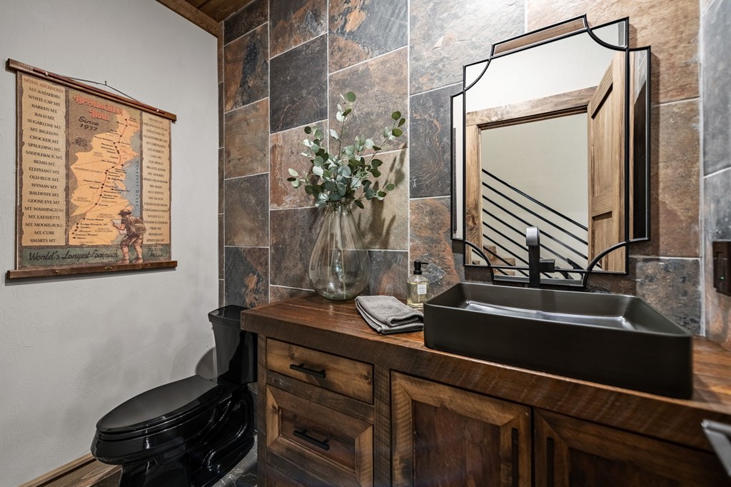 184 Spence Road Epworth, GA 30541 - Photo 57 of 62 a bathroom with a sink a mirror and a window