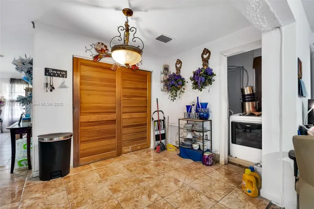 a view of a livingroom with furniture and closet
