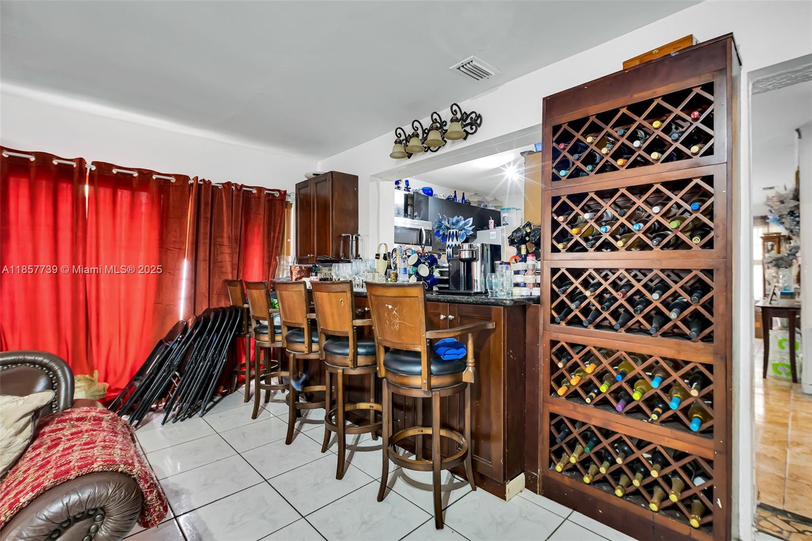 20415 Southwest 114th Court Miami, FL 33189 - Photo 20 of 23 a view of a dining room with furniture