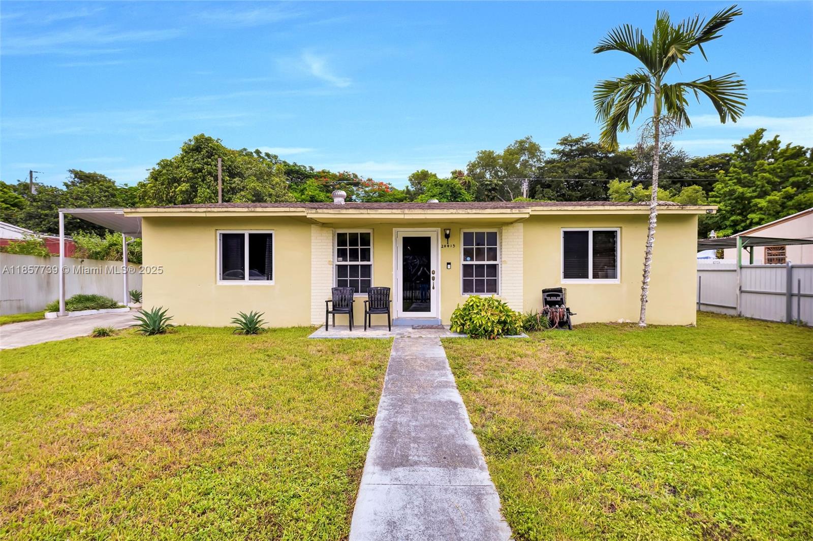 20415 Southwest 114th Court Miami, FL 33189 - Photo 2 of 23 a front view of house with yard and swimming pool
