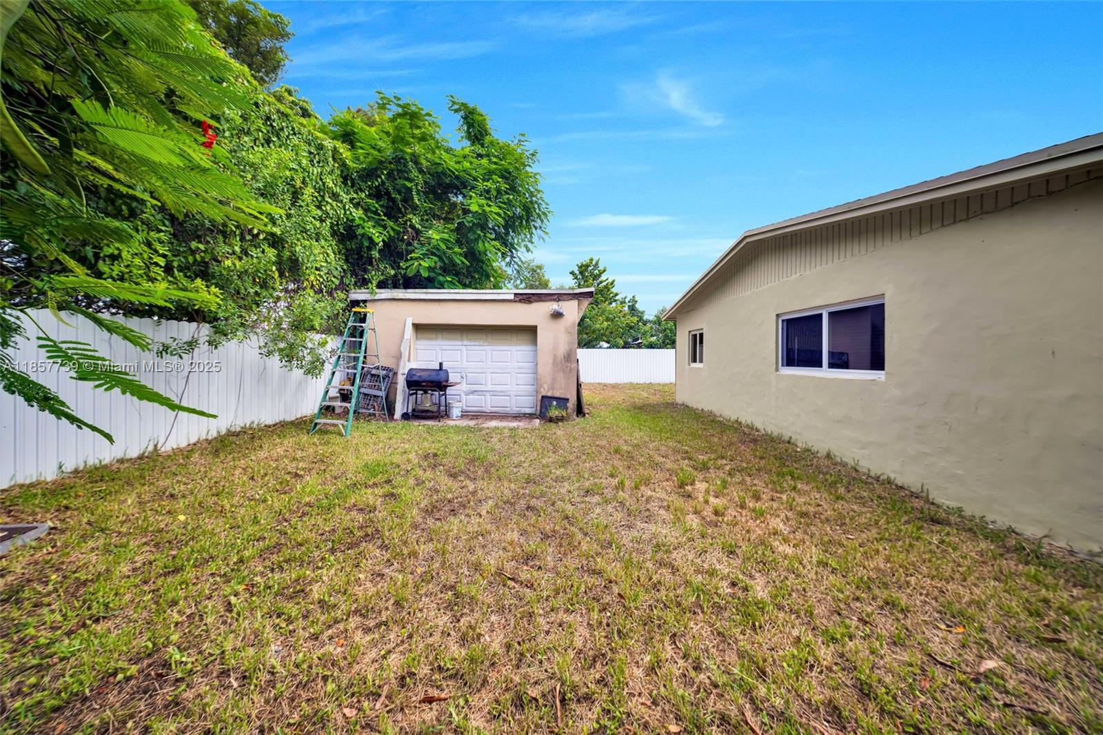 20415 Southwest 114th Court Miami, FL 33189 - Photo 21 of 23 a backyard of a house with lots of green space