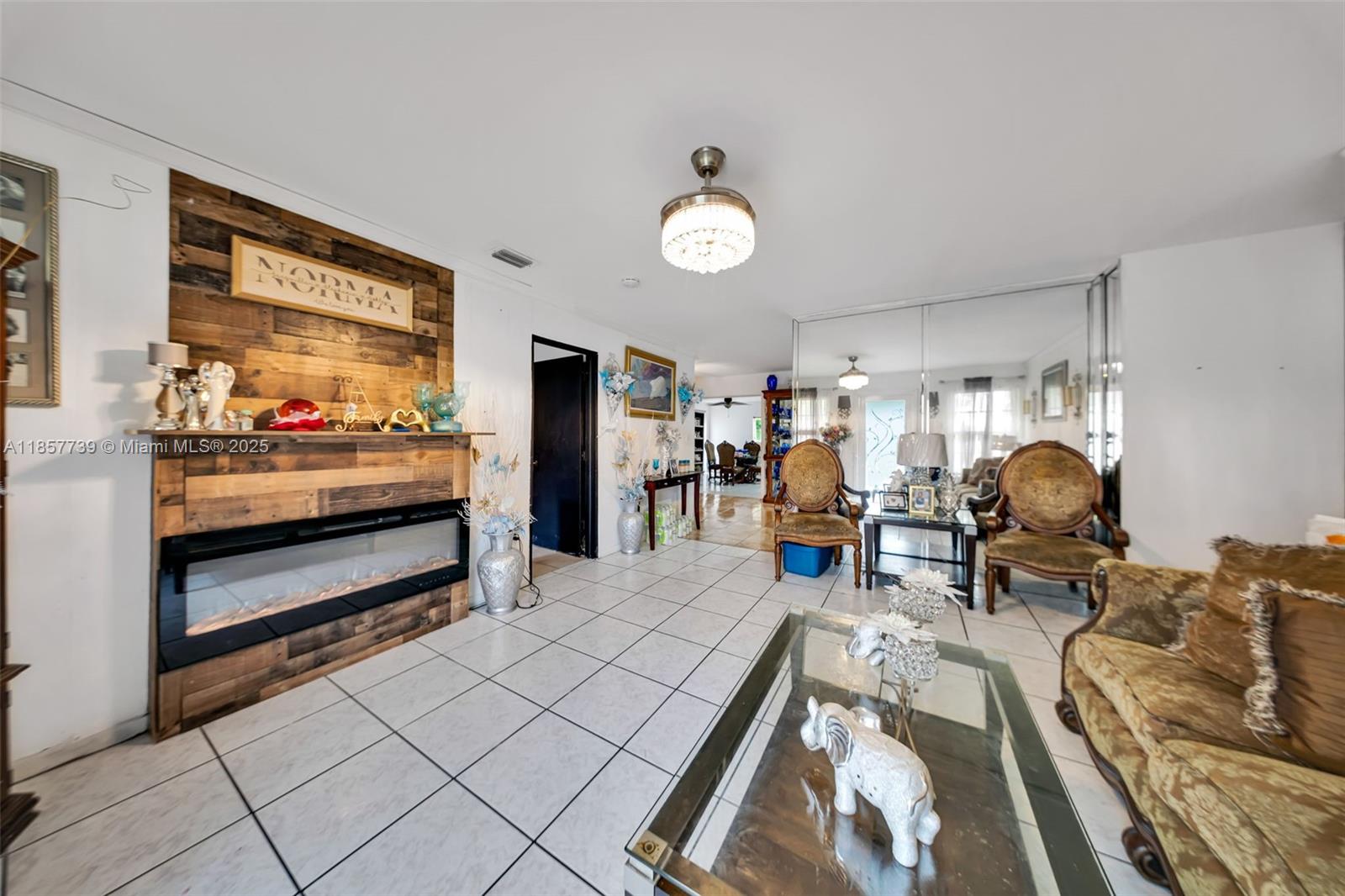 20415 Southwest 114th Court Miami, FL 33189 - Photo 4 of 23 a living room with furniture and a large window