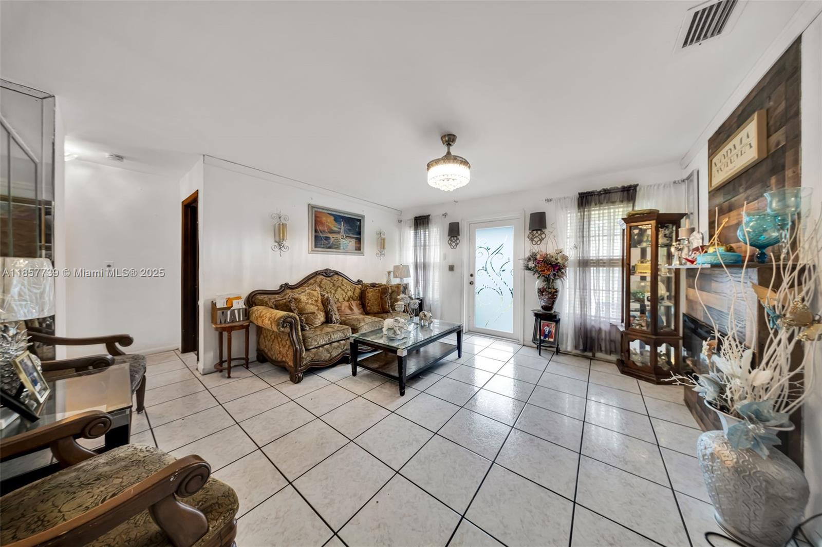 20415 Southwest 114th Court Miami, FL 33189 - Photo 5 of 23 a living room with furniture
