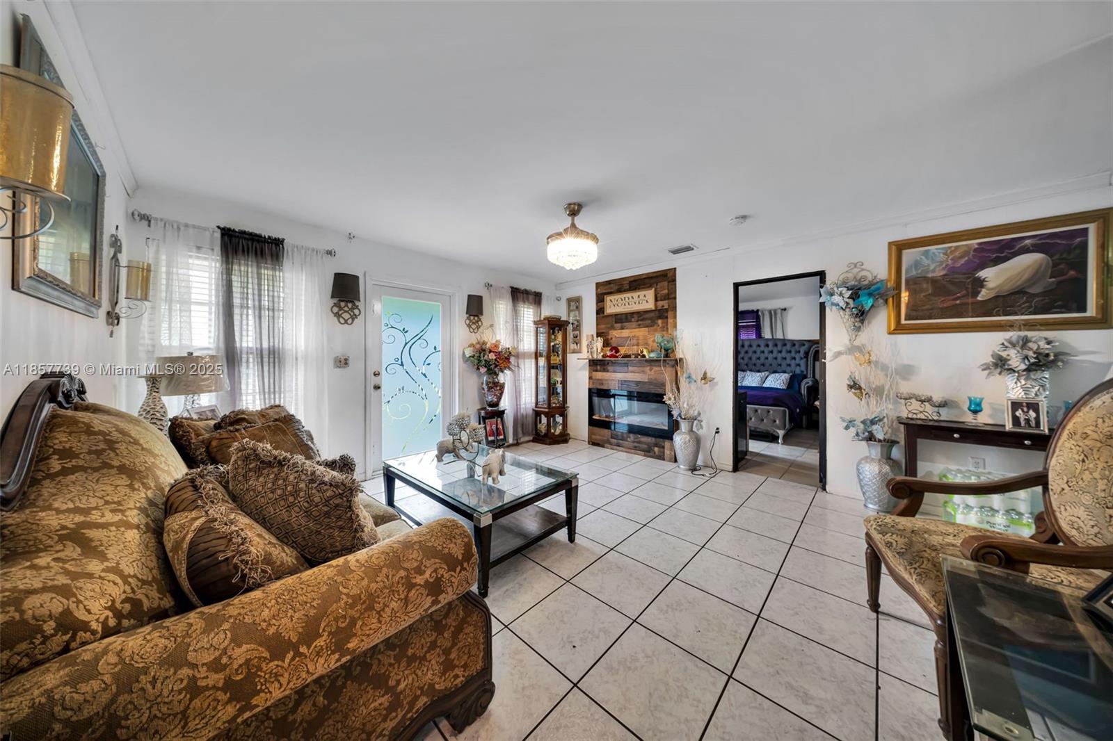 20415 Southwest 114th Court Miami, FL 33189 - Photo 6 of 23 a living room with furniture and a fireplace