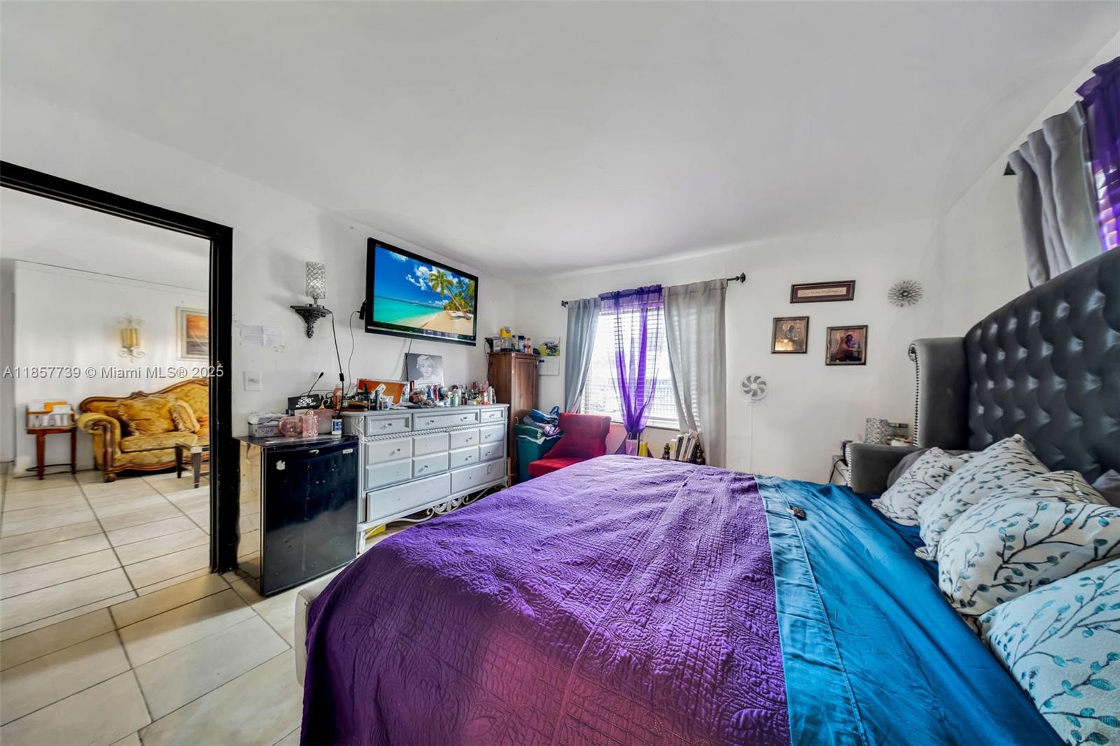 20415 Southwest 114th Court Miami, FL 33189 - Photo 8 of 23 a bedroom with a bed and a couch