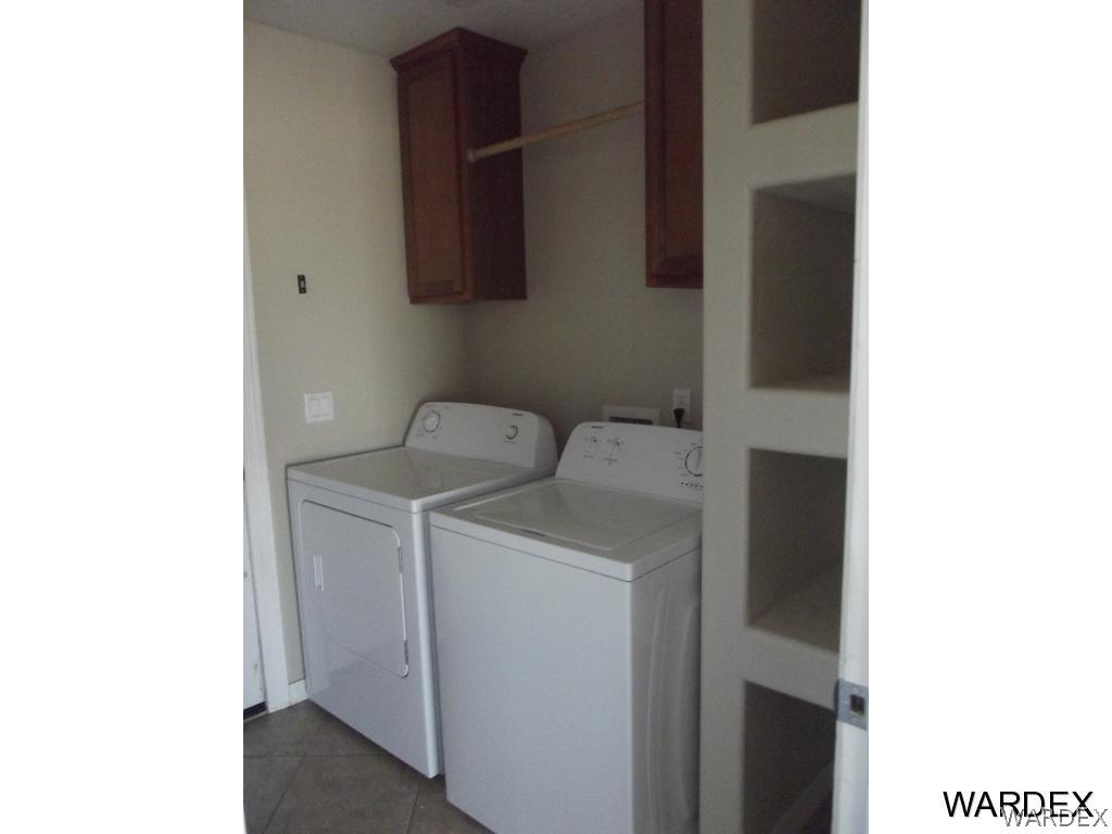 4422 Concho Road Golden Valley, AZ 86413 - Photo 8 of 14 a utility room with dryer and washer
