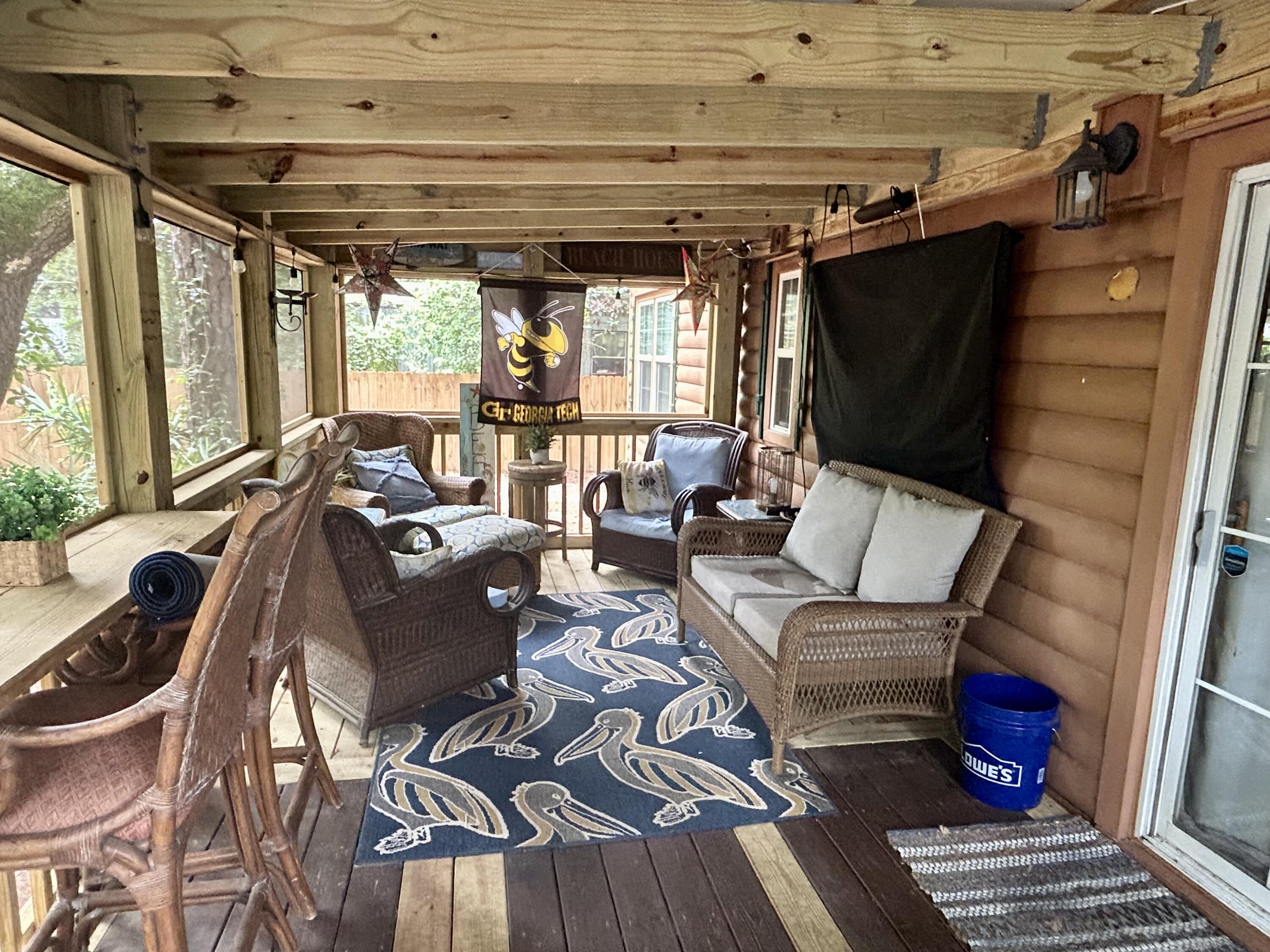 155 Madge Lane Santa Rosa Beach, FL 32459 - Photo 15 of 17 a living room with furniture and a flat screen tv