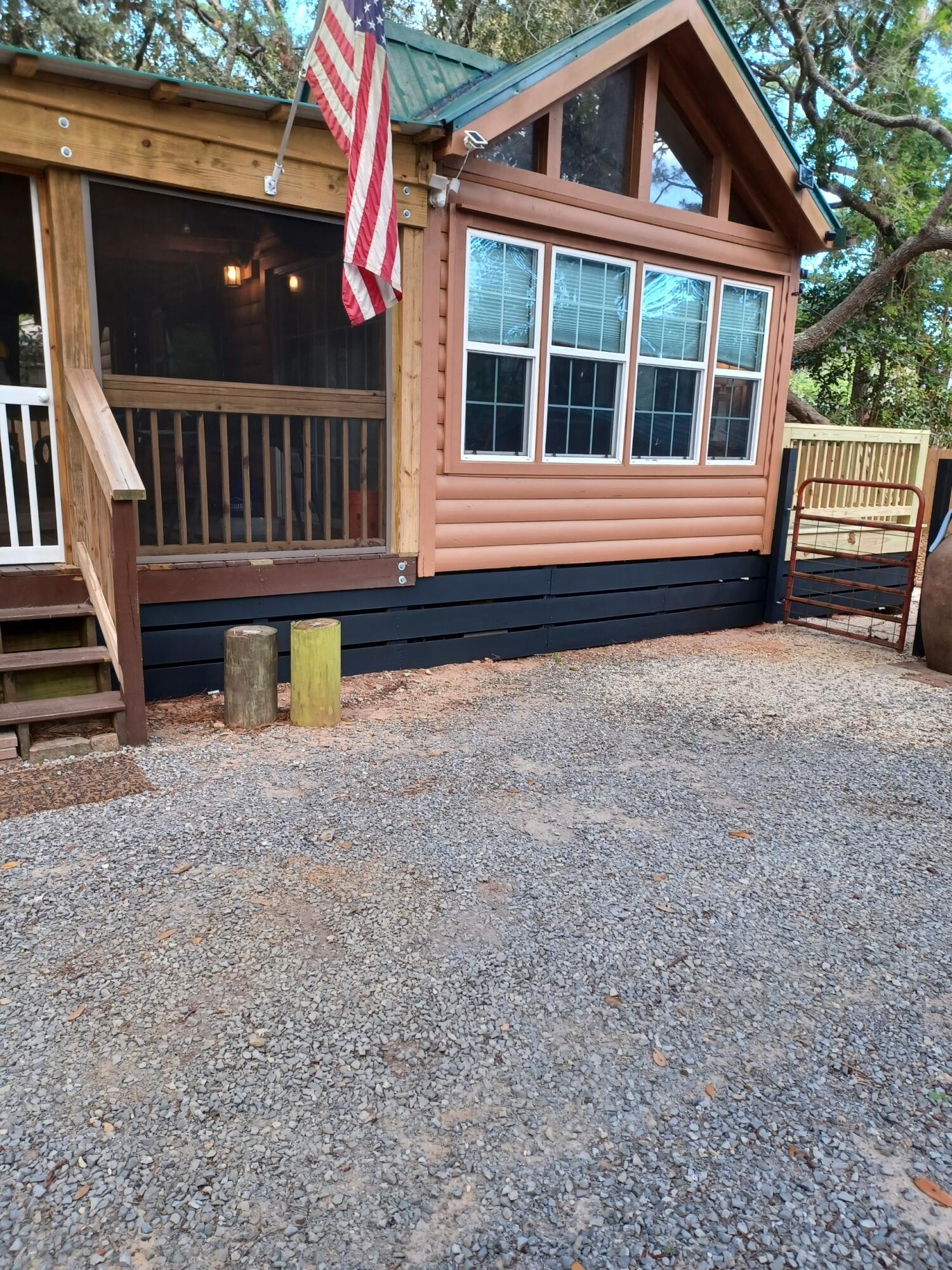 155 Madge Lane Santa Rosa Beach, FL 32459 - Photo 3 of 17 a view of house with a yard and sitting area